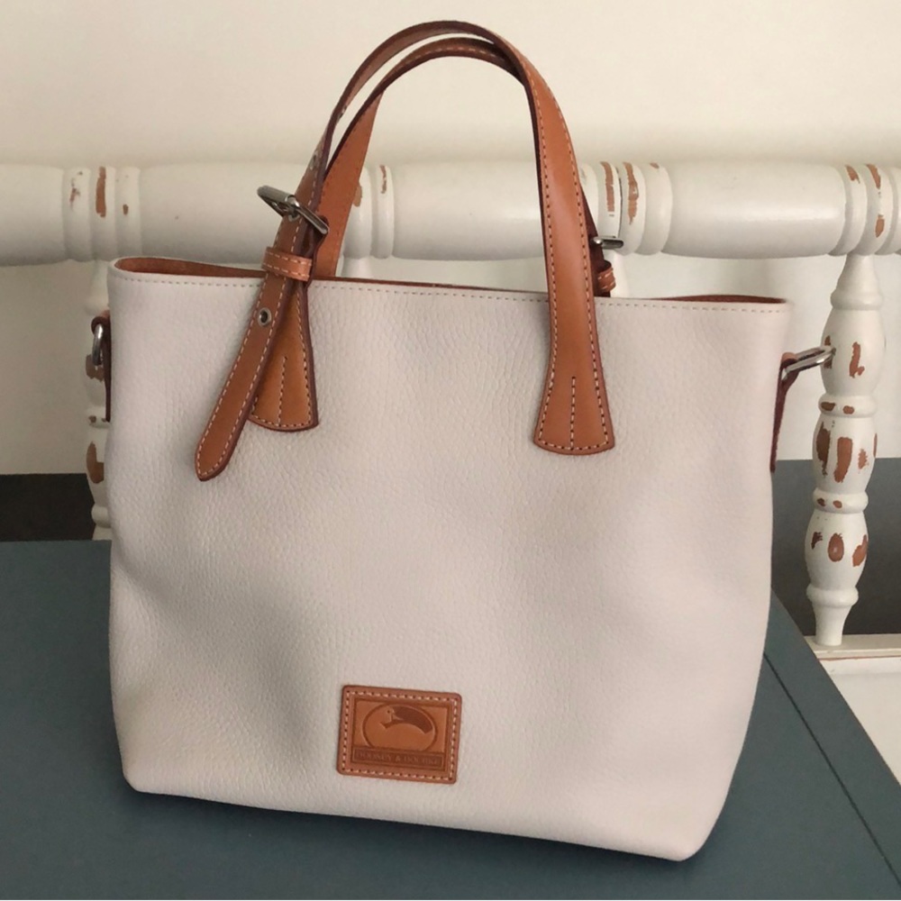 New with tags. Dooney and Bourke purse. In the color bone.